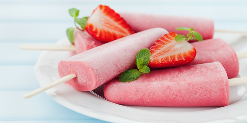 freeze dried strawberry popsicles on a plate