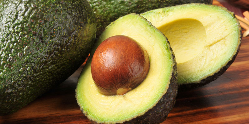 Avocado halved with pith exposed