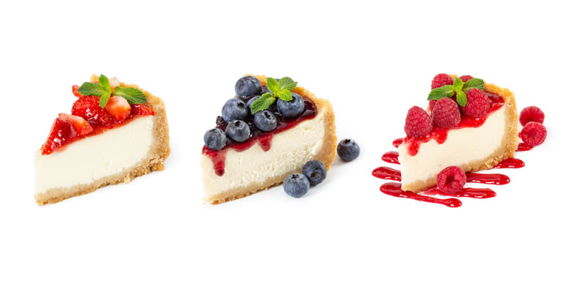 cheese cake slices with berry toppings